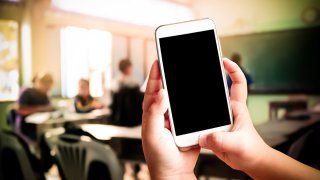 cellphone in class school shutterstock_434867950