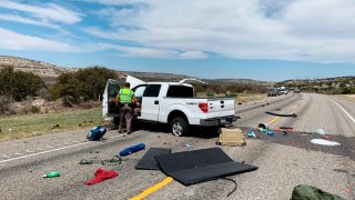 Debris is strewn across a road near the border city of Del Rio, Texas after a collision Monday, March 15, 2021.