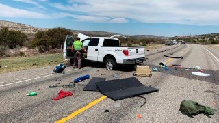 Debris is strewn across a road near the border city of Del Rio, Texas after a collision Monday, March 15, 2021.
