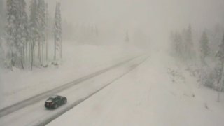 Very light traffic is seen in the snow along Interstate 80 at Donner Summit, Calif
