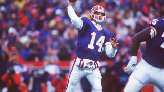 Buffalo Bills quarterback frank Reich sets and throws during the Bills 41-38 overtime win over the Houston Oilers in the AFC Playoff Game at Rich Stadium in Orchard Park, New York, on Jan. 3, 1993.