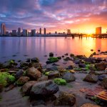 A surreal sunrise of downtown San Diego skyline taken from Coronado