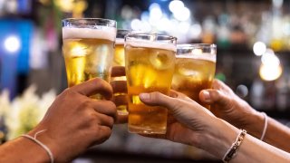 People cheers with beer.