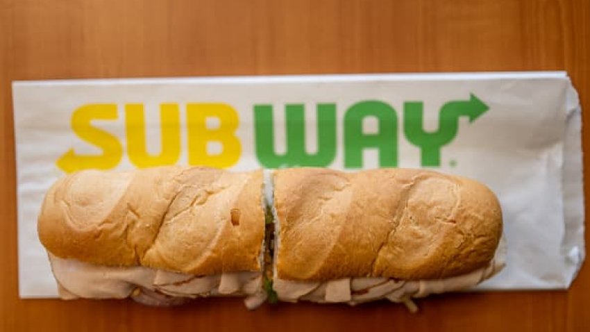 In this photo illustration, a Subway sandwich is seen on a table at a Subway restaurant on January 12, 2023 in Austin, Texas.