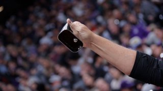 Sacramento Kings fan ringing a cowbell.