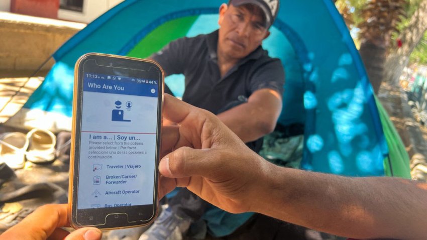 A migrant shows the CBP One App from the US Customs and Border Protection agency, to use to apply for an appointment to claim asylum, on a phone in Ciudad Juarez, Chihuahua state, Mexico, on May 10, 2023. The US on May 11, 2023, will officially end its 40-month Covid-19 emergency, also discarding the Title 42 law, a tool that has been used to prevent millions of migrants from entering the country. (Photo by Gilles CLARENNE / AFP) (Photo by GILLES CLARENNE/AFP via Getty Images)