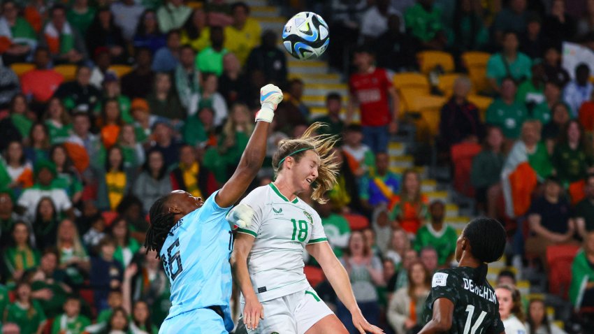 Nigeria’s goalkeeper #16 Chiamaka Nnadozie (L) punches clear before Ireland’s forward #18 Kyra Carusa (C) can head the ball during the Australia and New Zealand 2023 Women’s World Cup Group B football match between Ireland and Nigeria at Brisbane Stadium in Brisbane on July 31, 2023. (Photo by Patrick Hamilton / AFP) (Photo by PATRICK HAMILTON/AFP via Getty Images)