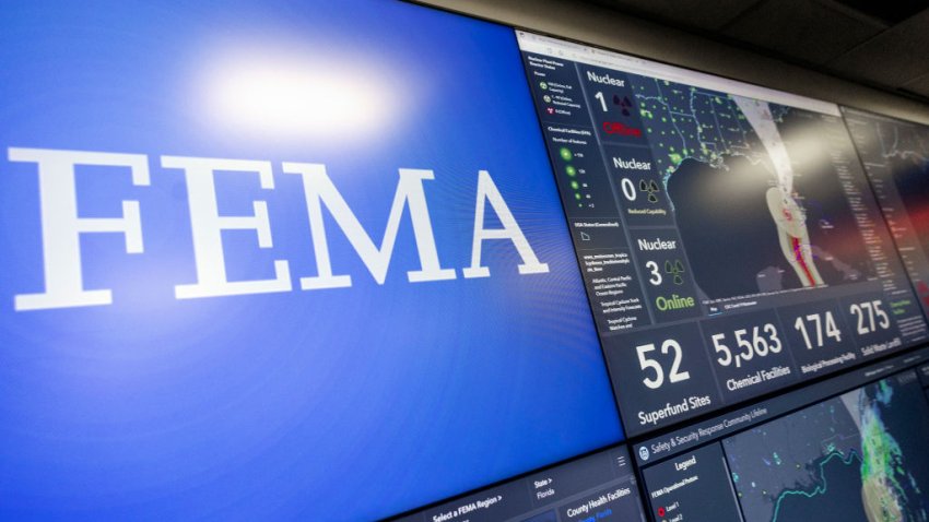 Screens display information on Hurricane Ian inside the National Response Coordination Center at the Federal Emergency Management Agency (FEMA) headquarters, on September 28, 2022 in Washington, DC.