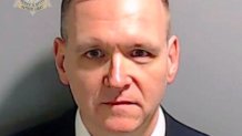 ATLANTA, GEORGIA - AUGUST 25: In this handout provided by the Fulton County Sheriff's Office, Trump campaign staff member Michael Roman poses for his booking photo at the Fulton County Jail on August 25, 2023 in Atlanta, Georgia. Former President Donald Trump and 18 others facing felony charges in the indictment related to tampering with the 2020 election in Georgia have been ordered to turn themselves in by August 25. (Photo by Fulton County Sheriff's Office via Getty Images)