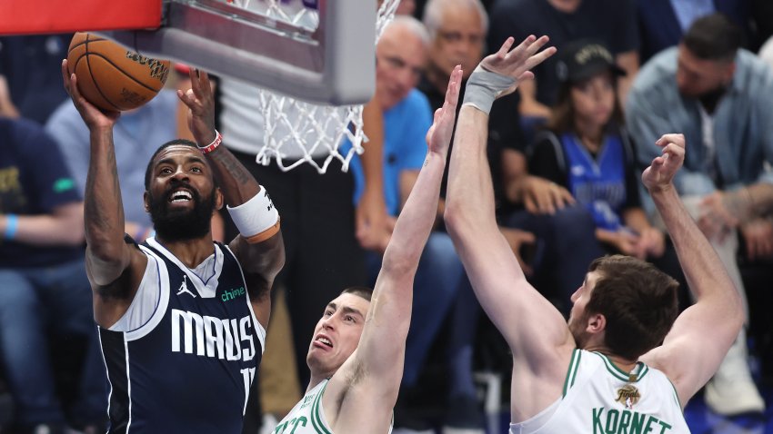 DALLAS, TEXAS – JUNE 14: Kyrie Irving #11 of the Dallas Mavericks shoots the ball against Payton Pritchard #11 of the Boston Celtics during the fourth quarter in Game Four of the 2024 NBA Finals at American Airlines Center on June 14, 2024 in Dallas, Texas. NOTE TO USER: User expressly acknowledges and agrees that, by downloading and or using this photograph, User is consenting to the terms and conditions of the Getty Images License Agreement. (Photo by Tim Heitman/Getty Images)