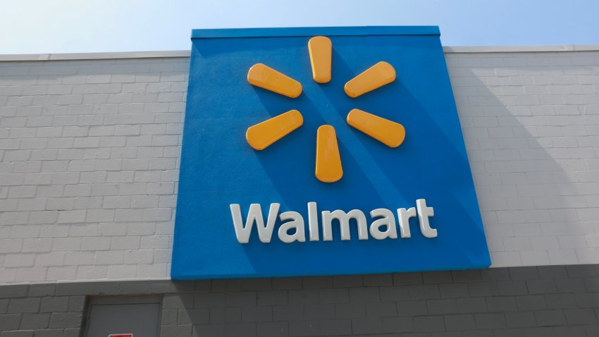 MIAMI, FLORIDA – MAY 14: A sign hangs near a Walmart store on May 14, 2024 in Miami, Florida. Walmart announced that it will eliminate several hundred corporate jobs and relocate most of its remaining remote office staff. (Photo by Joe Raedle/Getty Images)