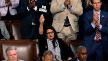 WASHINGTON, DC - JULY 24: Rep. Rashida Tlaib (D-MI) holds a sign that reads "War Criminal" as Israeli Prime Minister Benjamin Netanyahu addresses a joint meeting of Congress in the chamber of the House of Representatives at the U.S. Capitol on July 24, 2024 in Washington, DC. Netanyahu’s visit occurs as the Israel-Hamas war reaches nearly ten months. A handful of Senate and House Democrats boycotted the remarks over Israel’s treatment of Palestine. (Photo by Anna Moneymaker/Getty Images)