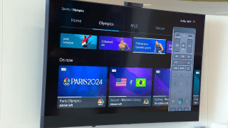 TV shows Xinity offerings for Paris Olympics along with an image of a voice remote.