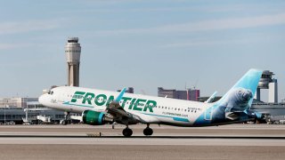 A Frontier Airlines plane lands at the McCarran International Airport in Las Vegas on Thursday, Feb. 27, 2020.
