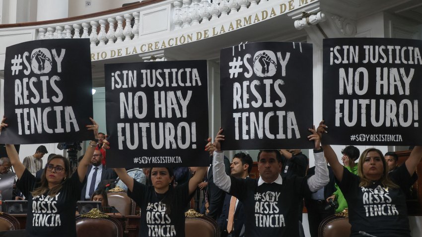 TOPSHOT – Local deputies take part in a protest holding signs that read in Spanish “Without justice, there is no future!” against the judicial reform in the Congress of Mexico City on September 12, 2024. Mexican President Andr√©s Manuel L√≥pez Obrador announced on Thursday that his controversial judicial reform, which provides for the election of all judges by popular vote, is ready to be enacted after winning the support of 18 state congresses. (Photo by Silvana FLORES / AFP) (Photo by SILVANA FLORES/AFP via Getty Images)