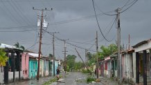 A man walks on a street during the pass of the Hurricane Rafael's eye in Pueblo Candelaria, Artemisa Province, 65 km west of Havana, on Nov. 6, 2024. Hurricane Rafael knocked out power to all of Cuba on Wednesday as it made landfall on the island still reeling from a recent blackout and a previous major storm, the national power company said.