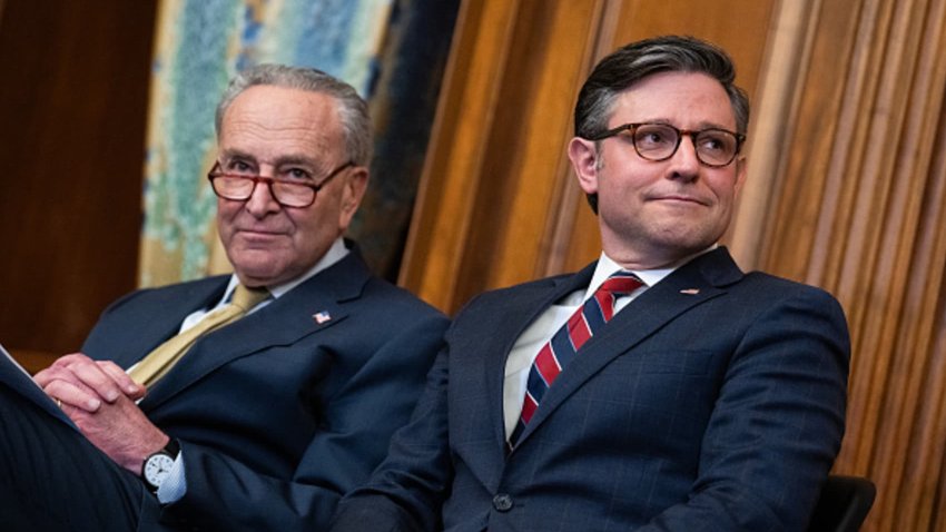 Senate Majority Leader Charles Schumer, D-N.Y., left, and Speaker of the House Mike Johnson, R-La., attend a Menorah lighting to celebrate the eight-day festival of Hanukkah, in the U.S. Capitol on Tuesday, December 12, 2023.