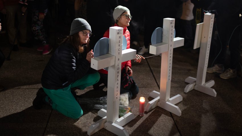 MADISON, WISCONSIN – DECEMBER 17: People leave messages on crosses during a vigil on the grounds of the state Capital building to mourn the victims of the shooting at Abundant Life Christian School on December 17, 2024 in Madison, Wisconsin. A 15-year-old female student opened fire at the school yesterday, killing a teacher and student and wounding six others, including two critically, before taking her own life, according to police.  (Photo by Scott Olson/Getty Images)