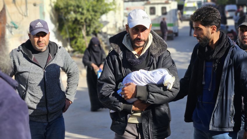 KHAN YUNIS, GAZA – DECEMBER 25: (EDITOR’S NOTE: Image depicts death) Lifeless body of Sile, who lost her life due to cold weather, is brought to Nasser Hospital for funeral process in Khan Yunis, Gaza on December 25, 2024. The displaced Fasih family, living in a makeshift tent in the Al-Mawasi, lost their two-week-old baby, Sile, due to the freezing conditions. (Photo by Hani Alshaer/Anadolu via Getty Images)