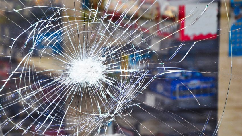 Shop window display with broken glass