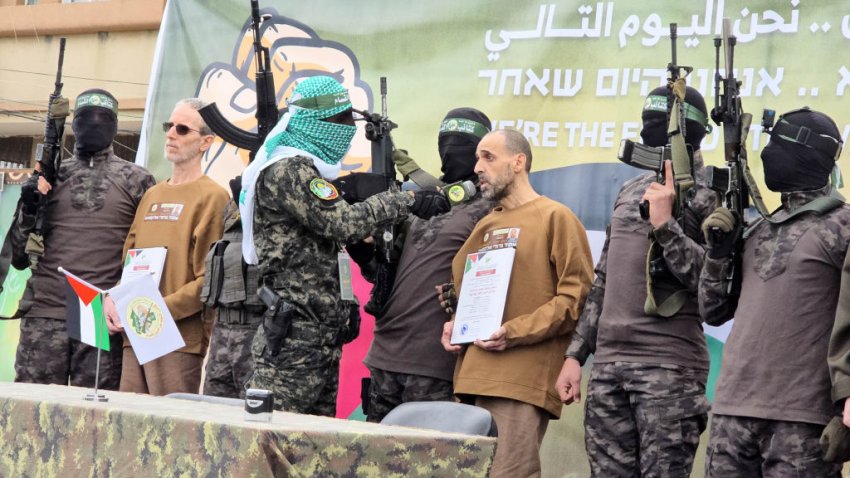 DEIR AL BALAH, GAZA – FEBRUARY 8: Al-Qassam Brigades, the armed wing of Hamas, hand over Israeli hostages Or Levy, Eliyahu Sharabi, and Ohad Ben Ami to the International Committee of the Red Cross on Saturday as part of the ongoing hostage swap in Deir al Balah, Gaza, on February 8, 2025. (Photo by Ashraf Amra/Anadolu via Getty Images)