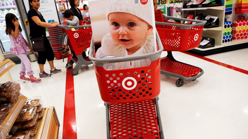 A customer’s cart carries a children’s car safety seat inside the Target Corp. Store in Torrance, California, U.S., on Tuesday, August 20, 2013. Target is expected to announce quarterly earnings results on Aug. 21, 2013. Photographer: Patrick T. Fallon/Bloomberg via Getty Images
