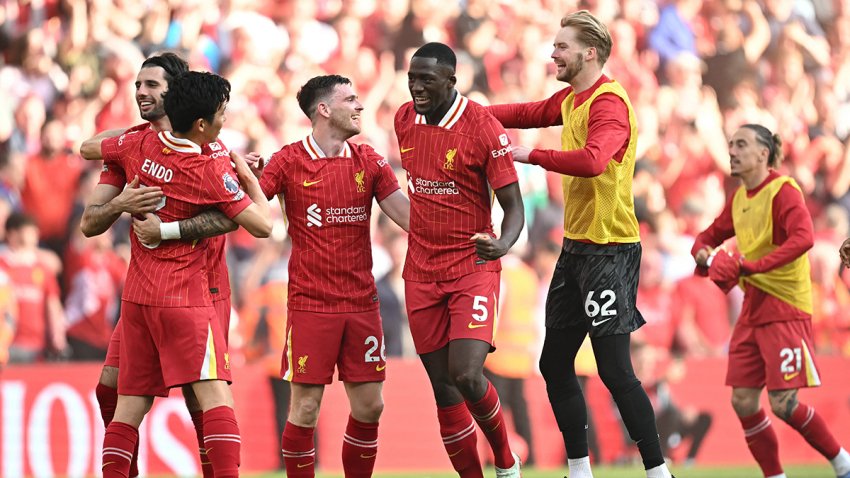 Liverpool’s players celebrate on the final whistle in the English Premier League football match between Liverpool and Tottenham Hotspur at Anfield in Liverpool, north west England on April 27, 2025. Liverpool were crowned English champions for a record-equalling 20th time as a 5-1 rout of Tottenham on Sunday sealed their first Premier League title since 2020. (Photo by Paul ELLIS / AFP) / RESTRICTED TO EDITORIAL USE. No use with unauthorized audio, video, data, fixture lists, club/league logos or ‘live’ services. Online in-match use limited to 120 images. An additional 40 images may be used in extra time. No video emulation. Social media in-match use limited to 120 images. An additional 40 images may be used in extra time. No use in betting publications, games or single club/league/player publications. /  (Photo by PAUL ELLIS/AFP via Getty Images)