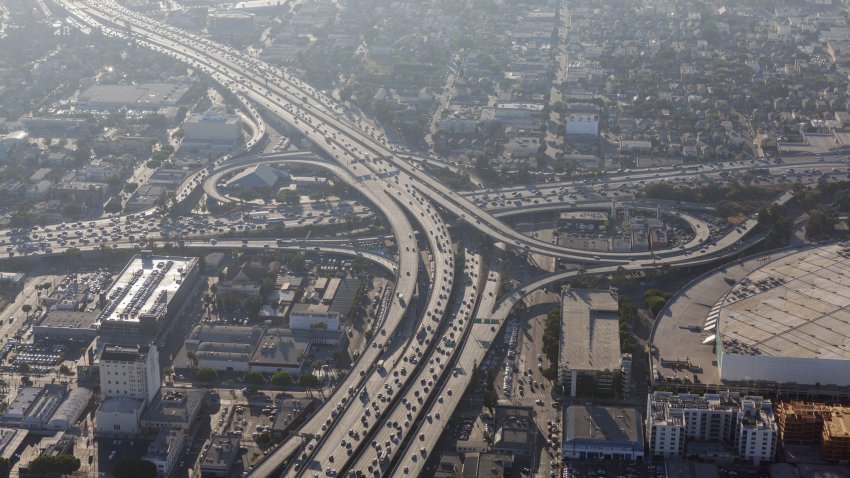 Smoggy afternoon aerial view of Harbor 110 and Santa Monica 10 freeways in downtown Los Angeles, California.