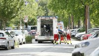 Rescue paramedics are seen next to an ambulance car close to a school where, according to reports, several people died in a shooting, on June 10, 2025 in Graz, southeastern Austria. Several people died in a school shooting, including the attacker, Austrian broadcaster ORF quoted the interior ministry as saying. (Photo by ERWIN SCHERIAU / APA / AFP) / Austria OUT (Photo by ERWIN SCHERIAU/APA/AFP via Getty Images)