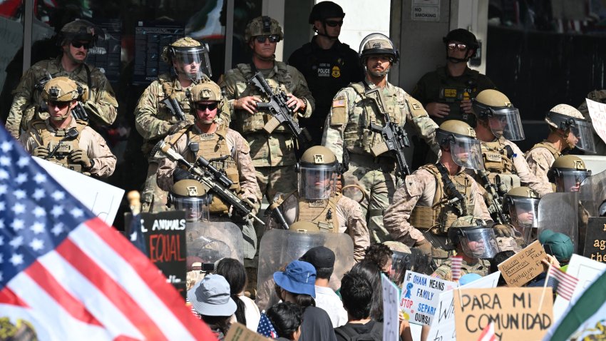 US Marines, California National Guard and police stand guard on the steps of the Federal Building on June 14, 2025 in Los Angeles, as protesters participating in the “No Kings” demonstration arrived in the area. Tens of thousands of protesters rallied nationwide Saturday against Donald Trump ahead of a huge military parade on the US president’s 79th birthday — as the killing of a Democratic lawmaker underscored the deep divisions in American politics. “No Kings” demonstrators took to the streets in New York, Los Angeles, Chicago, Philadelphia, Houston, Atlanta and hundreds of other cities across the United States to condemn what they call Trump’s dictatorial overreach. (Photo by Robyn Beck / AFP) (Photo by ROBYN BECK/AFP via Getty Images)