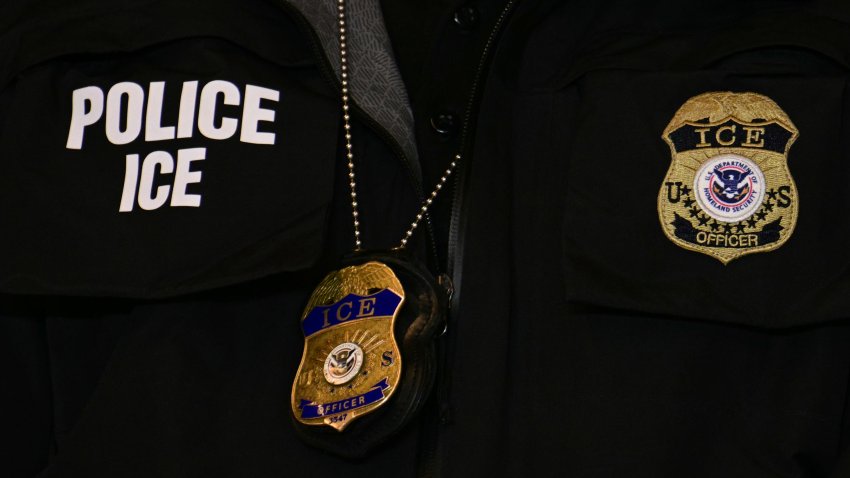 MINNEAPOLIS, MINNESOTA – JANUARY 22: An ICE patch and badge are seen on a Department of Homeland Security agent while US Vice President JD Vance speaks U.S. Vice President JD Vance gives remarks following a roundtable discussion with local leaders and community members amid a surge of federal immigration authorities in the area, at Royalston Square on January 22, 2026 in Minneapolis, Minnesota. The Trump administration has sent a reported 3,000-plus federal agents into the area, with more on the way, as they make a push to arrest undocumented immigrants in the region. (Photo by Jim Watson – Pool/Getty Images)