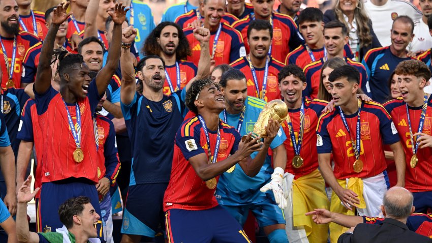 Lamine Yamal #19 of Spain lifts the FIFA World Cup Winner’s Trophy.