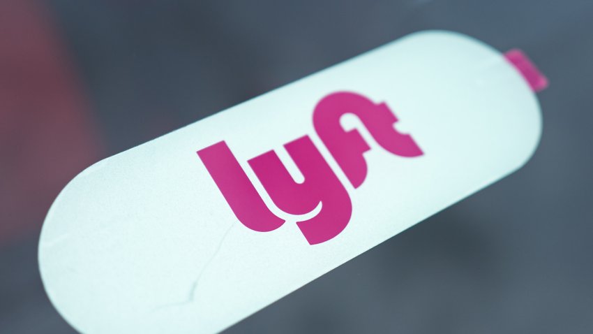 Close-up of logo for ride sharing and crowdsourced taxi service Lyft on a Lyft vehicle in the San Francisco Bay Area town of Daly City, California, November 3, 2017. (Photo by Smith Collection/Gado/Getty Images)